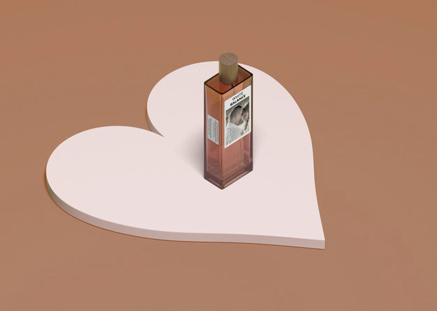 Bottle Of Perfume Seated On Heart Shape Psd