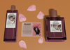 Bottles Of Perfume Beside Descriptive Card Psd