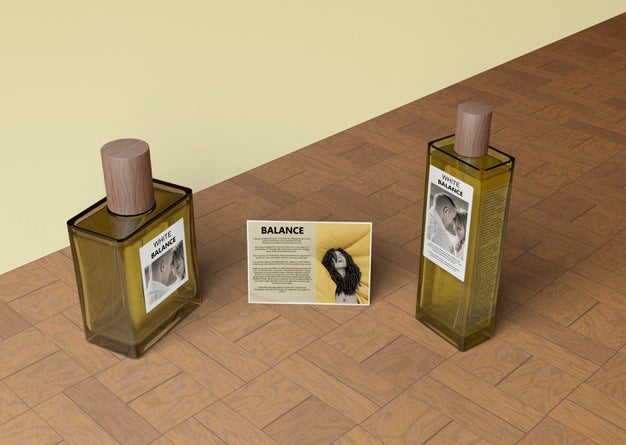 Bottles Of Perfume Beside Informational Card Psd