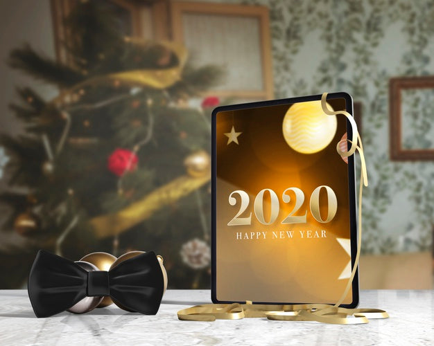Bow Tie Beside Tablet With Message For New Yeah Psd