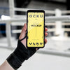Boxing Athlete Holding A Mock-Up Phone Psd