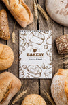 Bread And Notebook On Table Psd