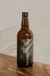 Brown Beer Bottle Mockup On Wooden Surface Psd