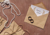 Brown Paper Envelopes Arrangement And Wedding Rings Psd