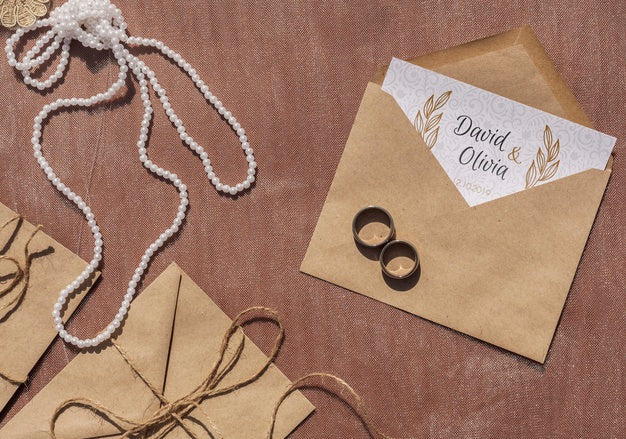 Brown Paper Envelopes Arrangement And Wedding Rings Psd