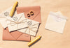 Brown Paper Envelopes With Wedding Invitations And Candles Psd