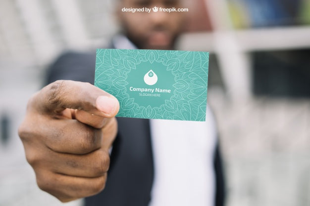 Business Card Mockup With Blurred Businessman Psd