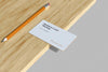 Business Card Mockup With Pencil On The Wood Psd