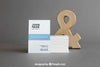 Business Card Mockup With Stack In Front Of Ampersand Psd