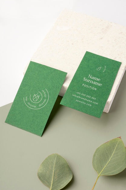 Business Cards Arrangement With Leaves Psd