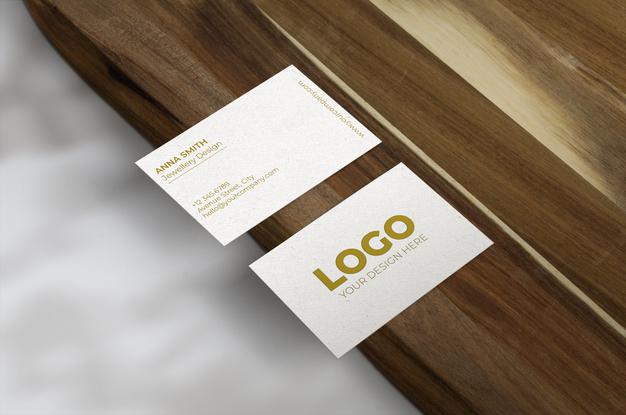 Business Cards Over Wood Surface Mockup Psd