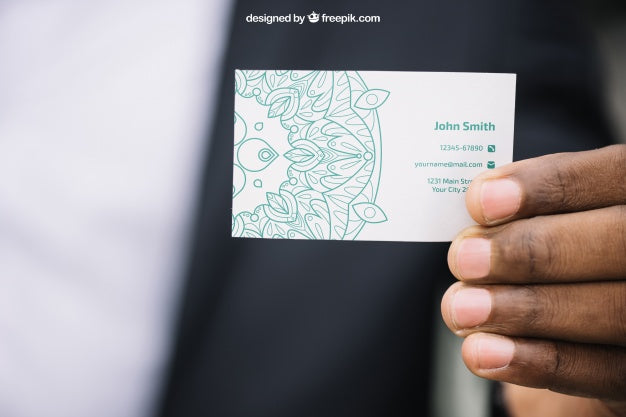 Business Mockup With Hand Showing Business Card Psd