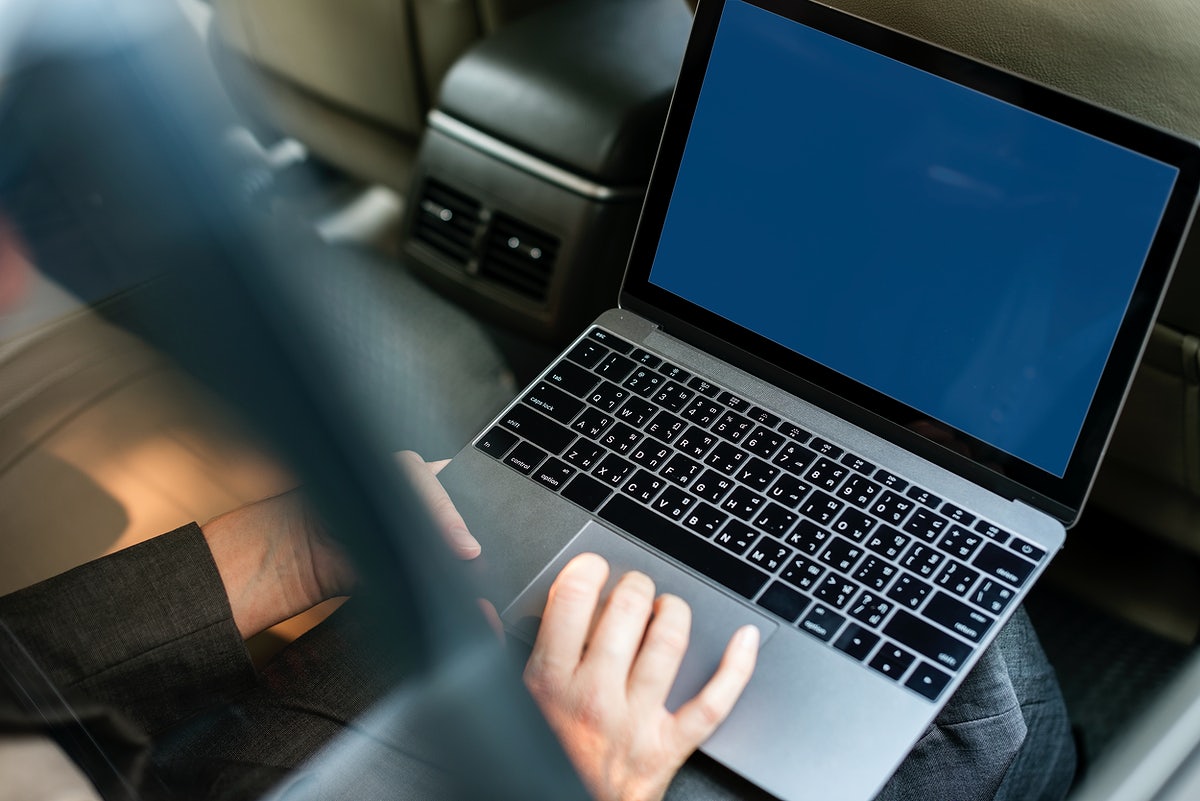 Business People Working Using Laptop Car Inside