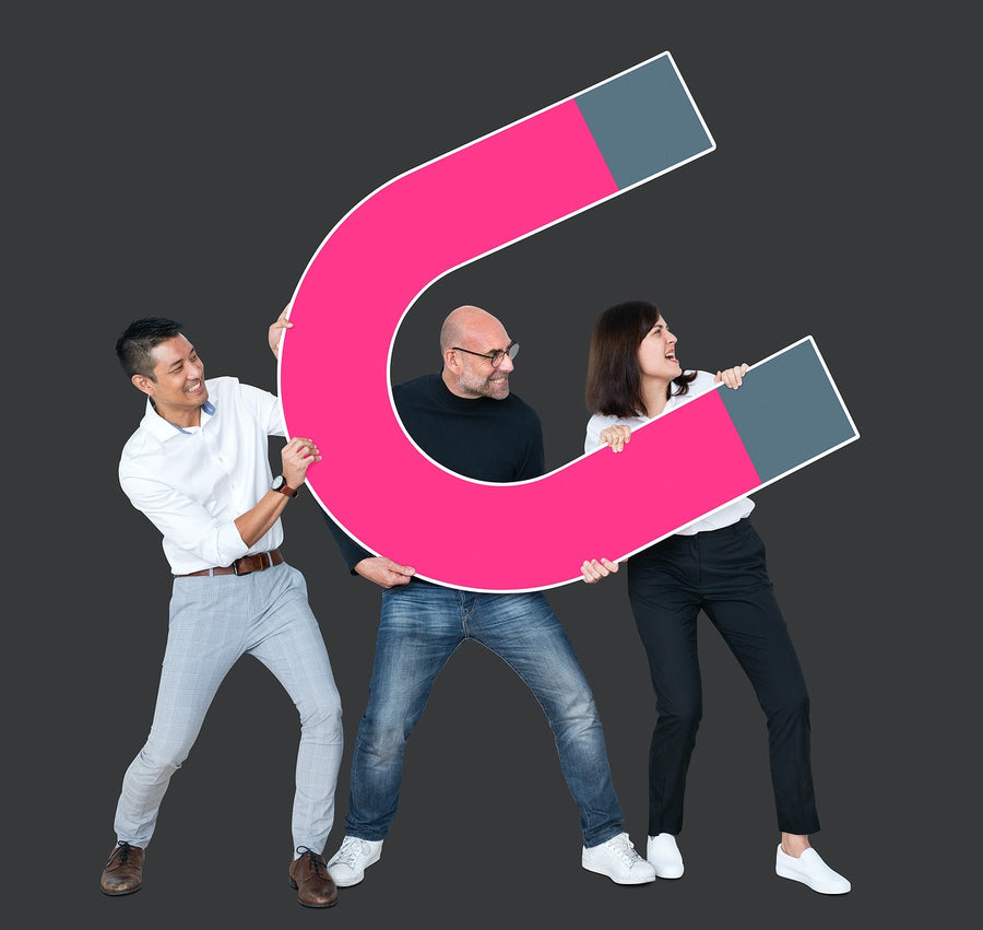 Business Team With A Large Magnet