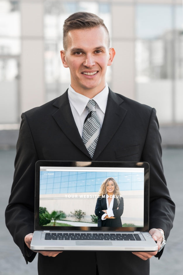 Businessman Presenting Laptop Mockup Psd
