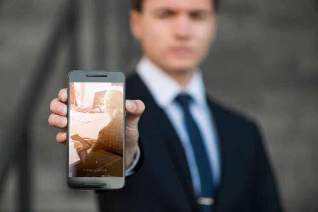 Businessman Presenting Smartphone Mockup Psd