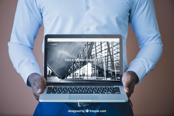 Businessman Showing Laptop Psd - Mockup Hunt