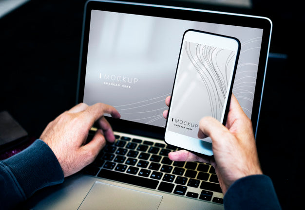 Businessman Using A Laptop And A Mobile Phone Mockup Psd