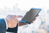 Businessman With Finger At Tablet In Front Of City Skyline Psd