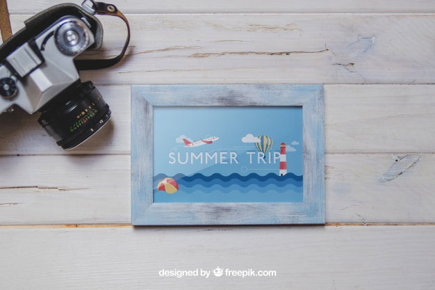Camera And Frame On Wooden Planks Psd