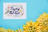 Card With Positive Message Beside Flowers Psd