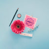 Cardboard Mock-Up With Flower And Make-Up On Blue Background Psd