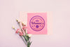 Cardboard Mock-Up With Flower On Pink Background Psd