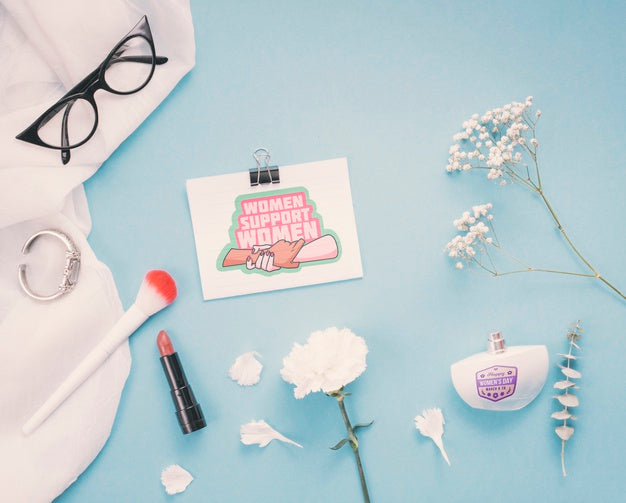 Cardboard Mock-Up With Flowers And Make-Up On Blue Background Psd