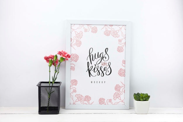 Carnation Flowers In Pencil Holder Next To Frame Mockup Psd