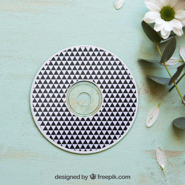 Cd Mockup Next To Flower Psd