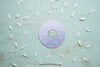 Cd Mockup With White Petals Psd