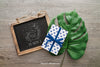 Chalkboard And Gift Box On A Leaf Psd