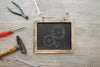 Chalkboard And Tools On Wooden Texture Psd