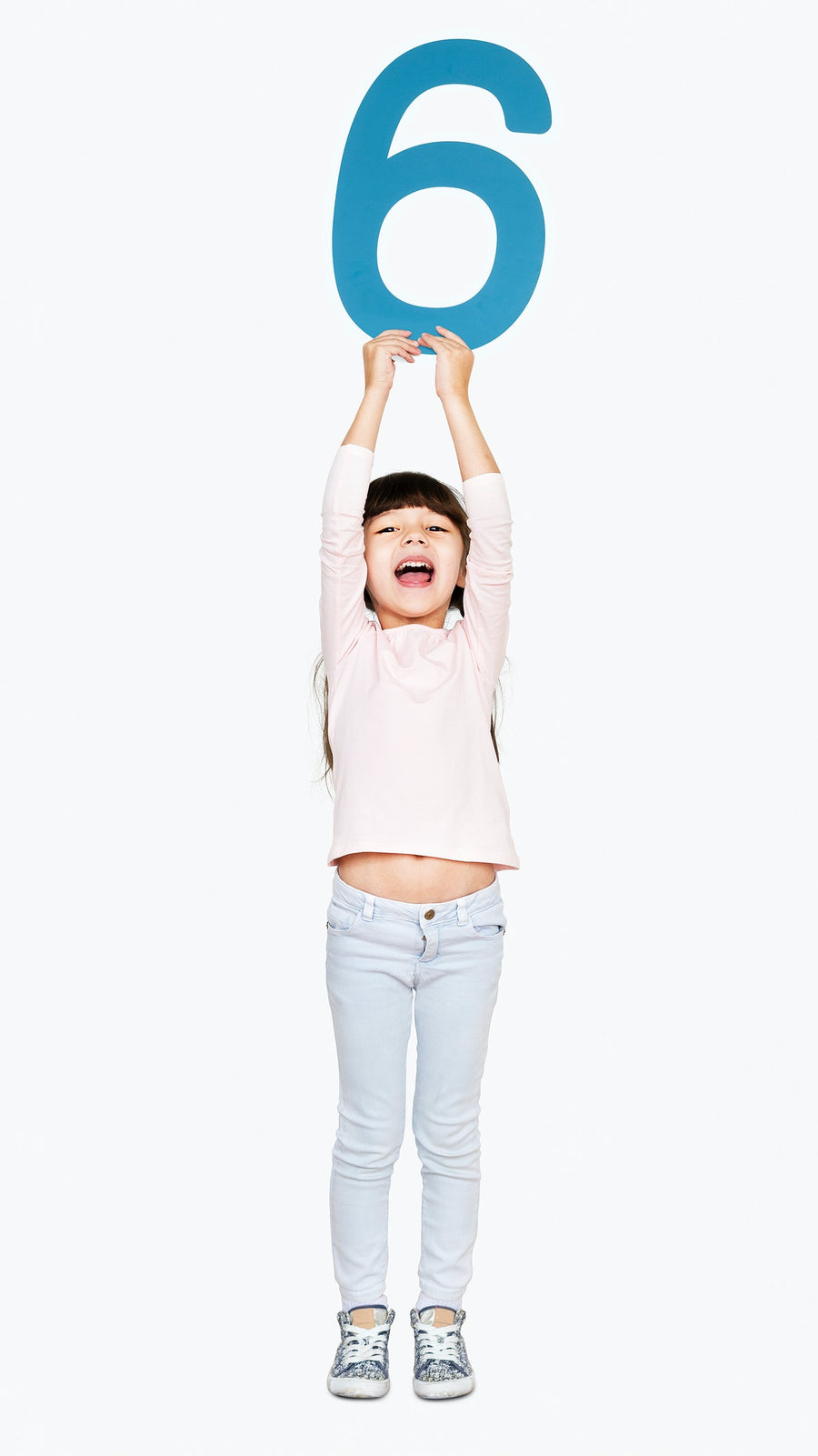 Cheerful Girl Holding Number Six