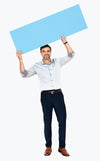 Cheerful Man Showing A Blank Blue Banner