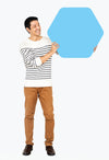 Cheerful Man Showing A Blank Blue Hexagon Board