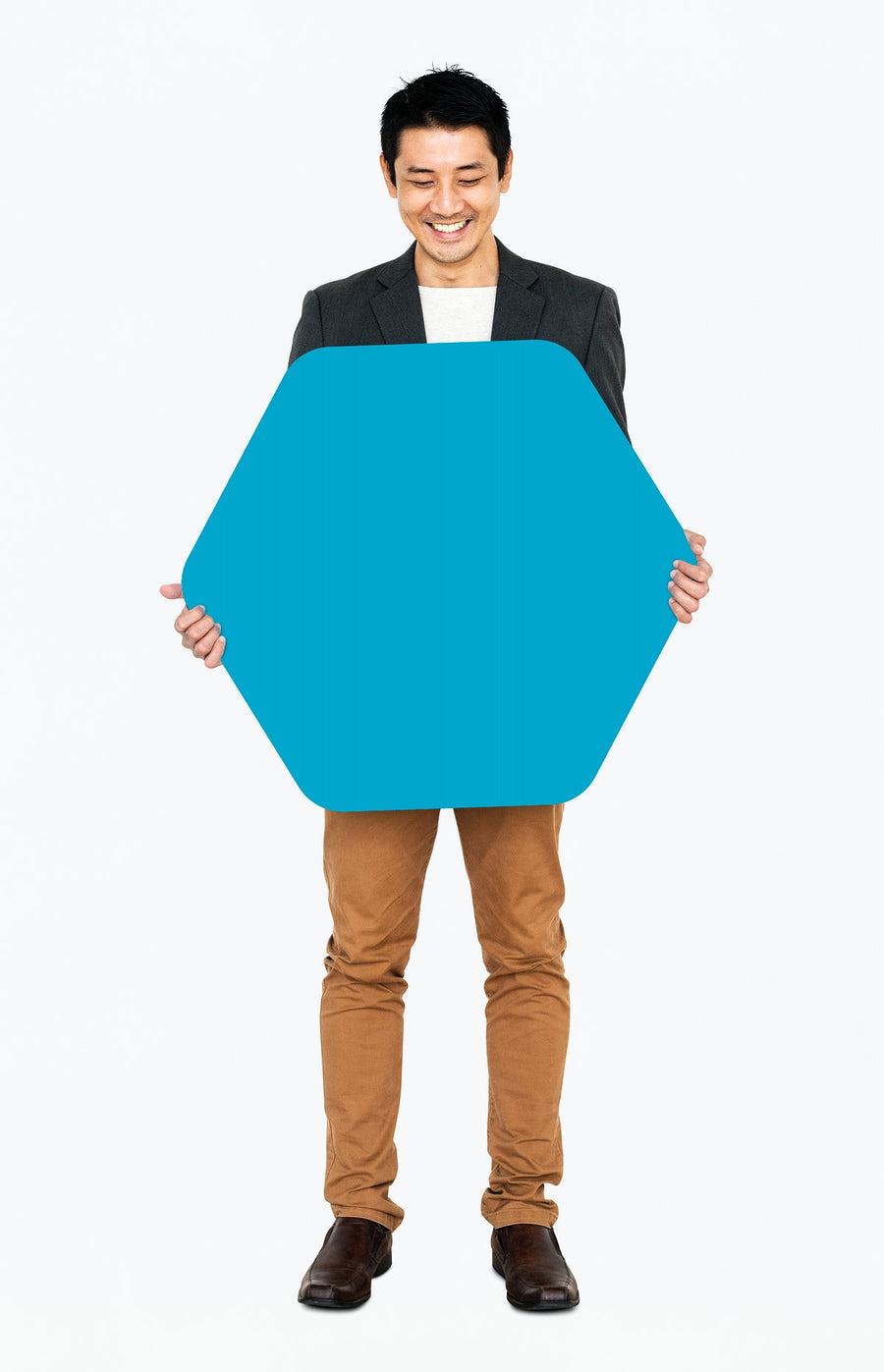 Cheerful Man Showing A Blank Blue Hexagon Shaped Board
