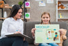 Child And Woman Holding A Mock-Up Clipboard Front View Psd