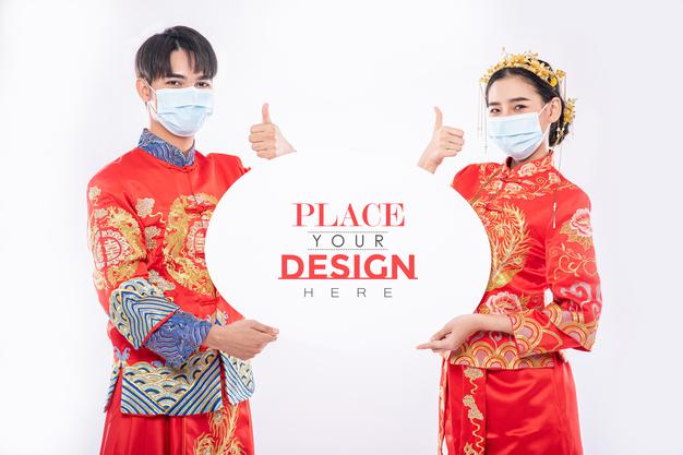 Chinese Man And Chinese Woman Hold Blank Speech Bubble Mockup Psd