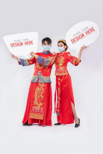 Chinese Man And Chinese Woman Hold Blank Speech Bubble Mockup Psd