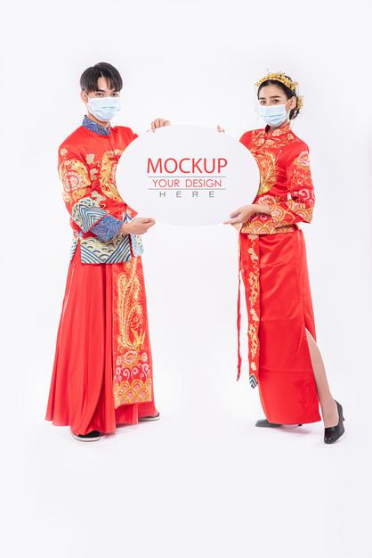Chinese Man And Chinese Woman Hold Blank Speech Bubble Mockup Psd