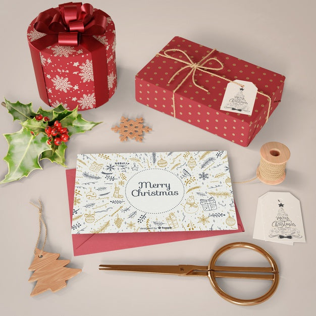 Christmas Card And Gifts Collection On Table Psd