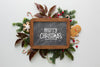 Christmas Composition With Lettering Written On Chalkboard Psd