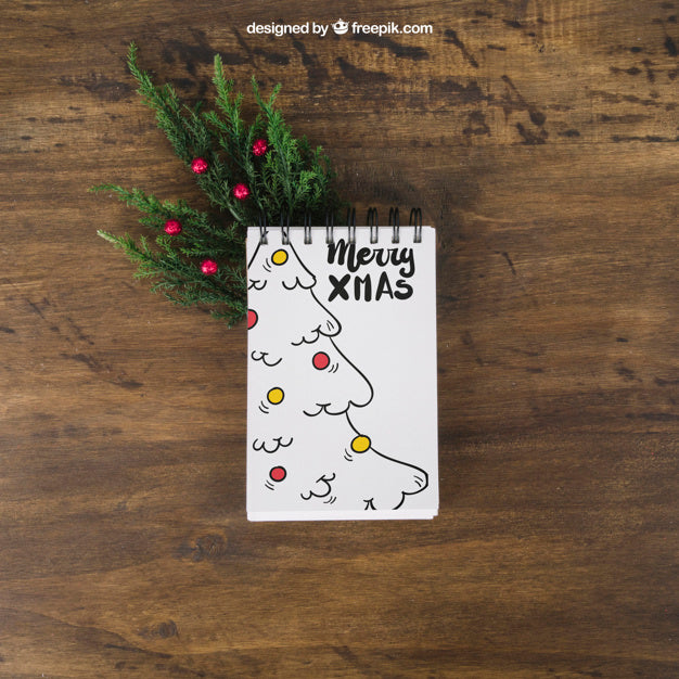 Christmas Mockup With Notepad On Mistletoe Psd