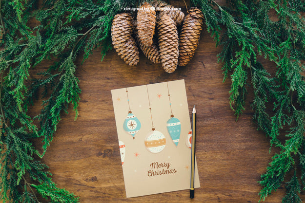 Christmas Mockup With Pine Cones And Greeting Card Psd