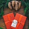 Christmas Mockup With Present And Pine Cones Psd