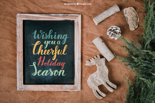 Christmas Mockup With Slate Next To Ornaments Psd