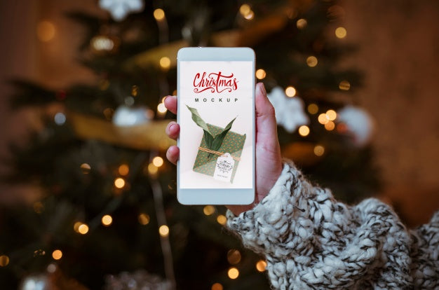 Christmas Sale Mockup With Hand Holding Smartphone Psd
