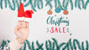 Christmas Sale With Santa'S Hat On A Hand Psd