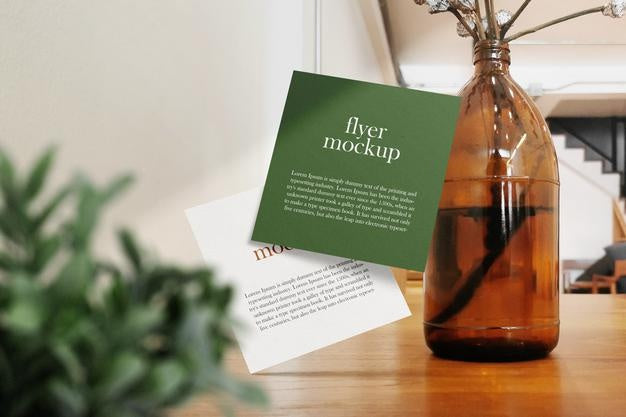 Clean Minimal Square Flyer Mockup Floating On Wood Top In Cafe Background. Psd File. Psd